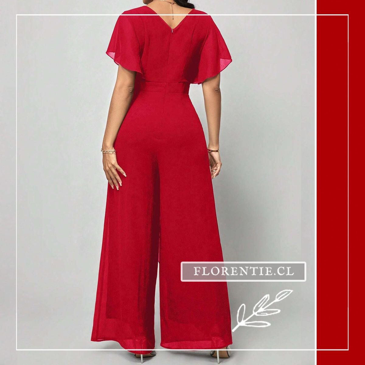 Vista trasera del enterito largo rojo de fiesta mostrando la cremallera posterior oculta, mangas tipo mariposa con vuelo y caída del pantalón palazzo wide leg en rojo carmín