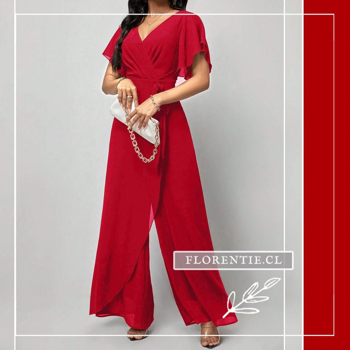 Vista completa del jumpsuit rojo carmín con mangas tipo mariposa, cinturón de lazo y pantalón palazzo de panel superpuesto que revela sutilmente la pierna al caminar