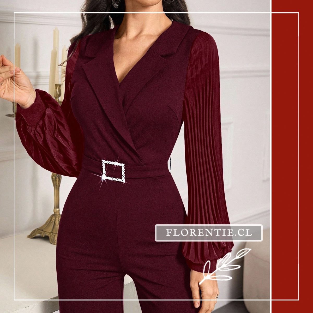 Primer plano del corpiño del enterito burdeo con solapas cruzadas estilo blazer, mangas de tejido plisado vertical y cinturón con hebilla cuadrada de cristales