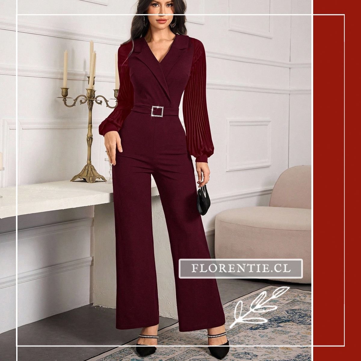 Vista frontal del jumpsuit burdeo con escote en V cruzado estilo blazer, mangas plisadas fluidas, hebilla de cristales y pantalón de corte recto