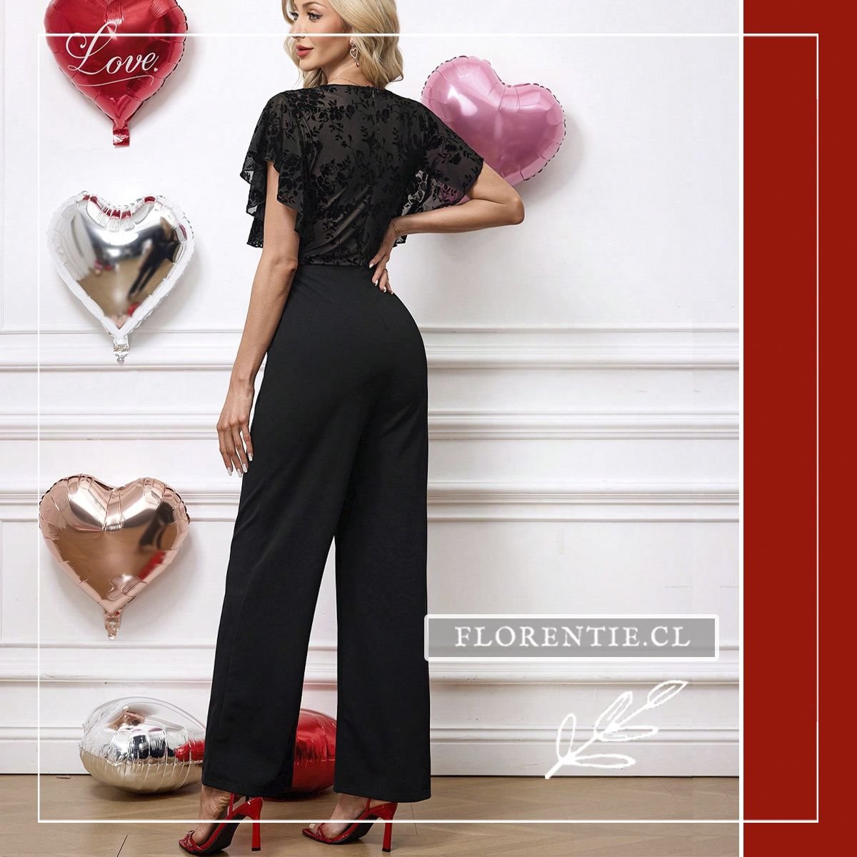 Vista trasera del enterito negro Dana mostrando la caída del pantalón palazzo elasticado y las mangas cortas tipo mariposa con tela semi-translúcida floral